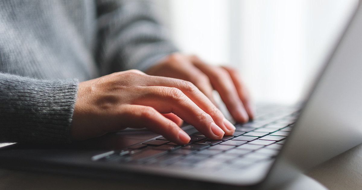 woman's hands on laptop woman's hands on laptop