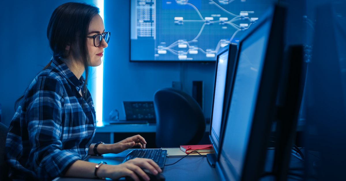 An IT programmer performing coding An IT programmer performing coding