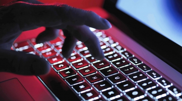 Hand on backlit keyboard