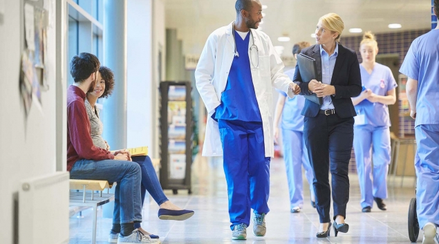 Hospital staff walking in hallway