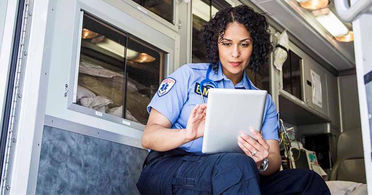 Paramedic using tablet Paramedic using tablet