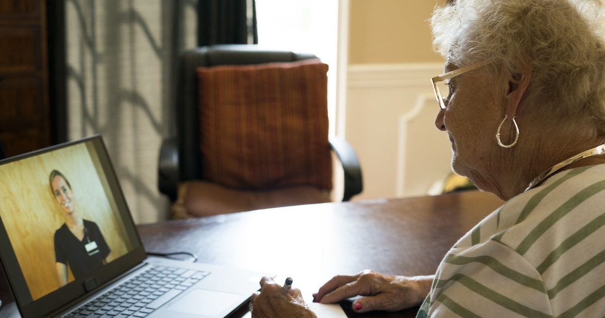 Person speaking to healthcare worker on laptop Person speaking to healthcare worker on laptop