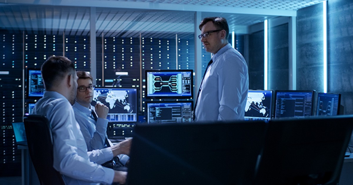 IT professionals meet in a server room