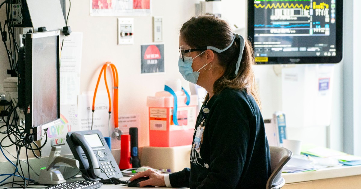 public health nurse examines data on a computer public health nurse examines data on a computer