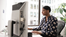 Woman at desktop computer