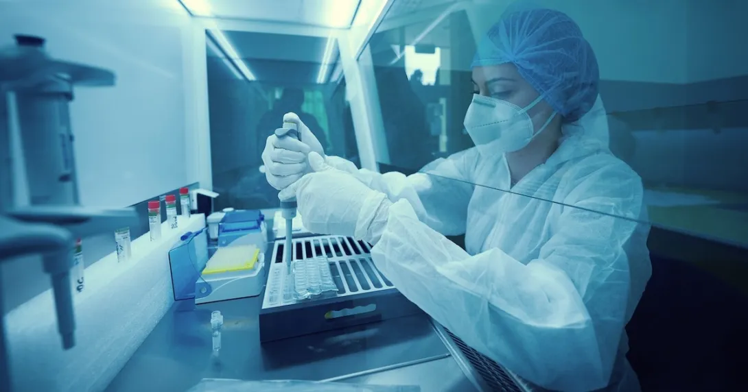 Lab worker in full protective gear Lab worker in full protective gear