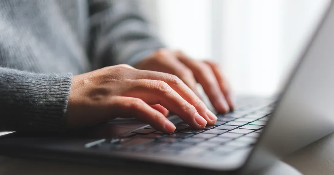 woman's hands on laptop woman's hands on laptop