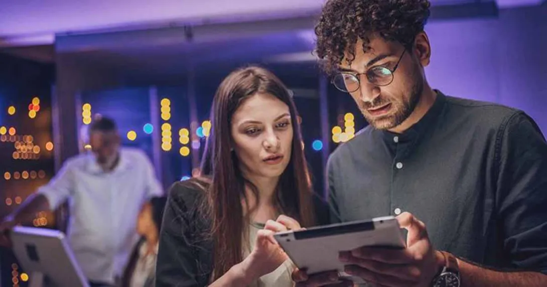 People looking at a tablet People looking at a tablet