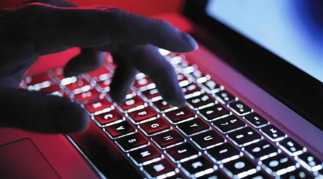 Hand on backlit keyboard